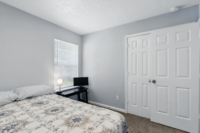 1961 Spring Drive Rd, Jacksonville, FL 32209 - carpeted bedroom featuring a textured ceiling and a closet