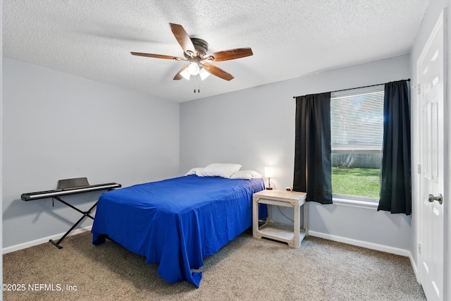 1961 Spring Drive Rd, Jacksonville, FL 32209 - bedroom with a textured ceiling, carpet, baseboards, and a ceiling fan