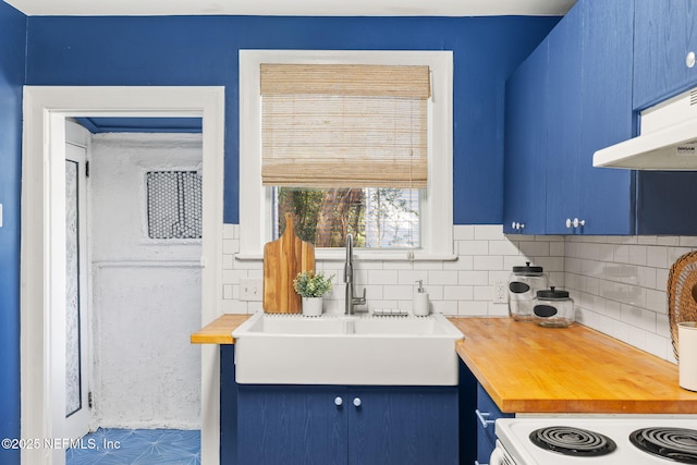 3712 Trask St, Jacksonville, FL 32205 - kitchen with wood counters, blue cabinets, a sink, decorative backsplash, and white range with electric cooktop