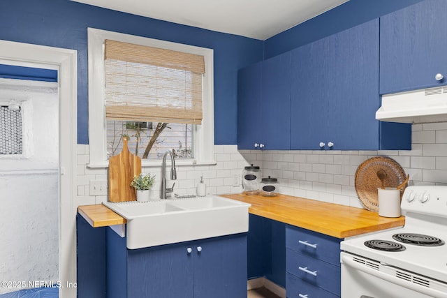 3712 Trask St, Jacksonville, FL 32205 - kitchen featuring white range with electric stovetop, under cabinet range hood, blue cabinets, and butcher block counters