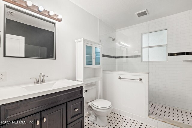 3712 Trask St, Jacksonville, FL 32205 - bathroom featuring a walk in shower, vanity, toilet, and tile patterned floors