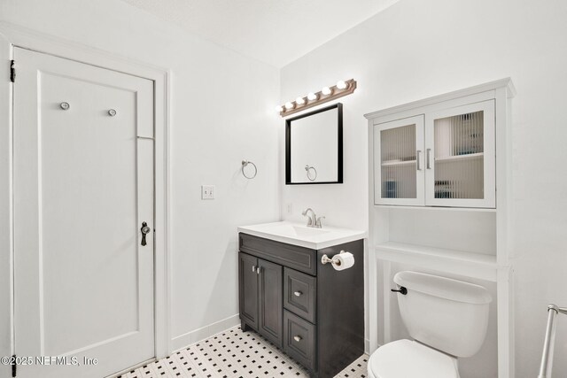 3712 Trask St, Jacksonville, FL 32205 - bathroom with vanity, toilet, baseboards, and tile patterned floors