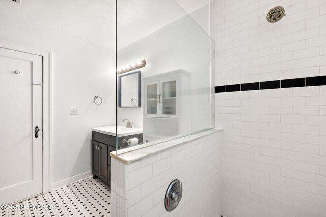 3712 Trask St, Jacksonville, FL 32205 - full bath featuring a tile shower, tile patterned floors, vanity, and baseboards