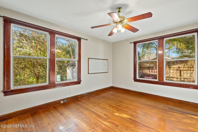 3712 Trask St, Jacksonville, FL 32205 - empty room with healthy amount of natural light, baseboards, and wood finished floors
