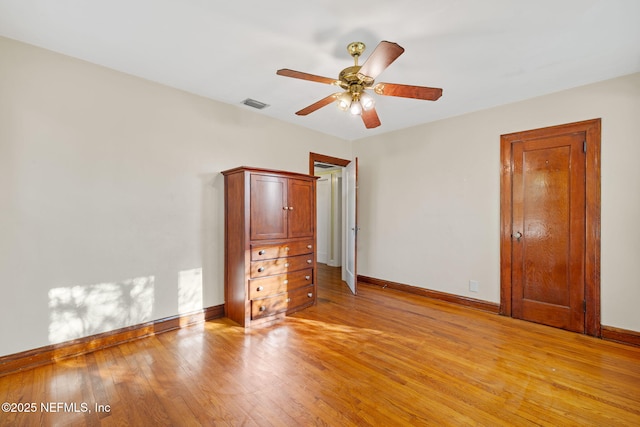 3712 Trask St, Jacksonville, FL 32205 - unfurnished bedroom featuring baseboards, light wood-style flooring, and a ceiling fan