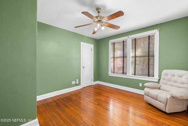 3712 Trask St, Jacksonville, FL 32205 - living area with baseboards, wood finished floors, and ceiling fan