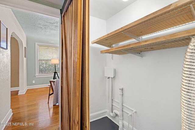 3712 Trask St, Jacksonville, FL 32205 - walk in closet featuring wood finished floors and arched walkways