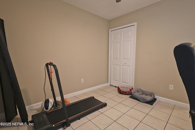 502 Vermont Ave, Green Cove Springs, FL 32043 - workout room featuring light tile patterned flooring, baseboards, and a ceiling fan