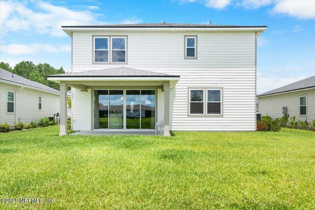 1828 Amberly Dr, Middleburg, FL 32068 - rear view of property with a yard