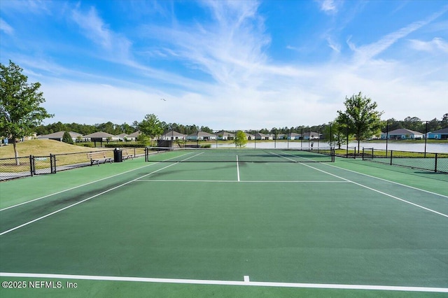 1828 Amberly Dr, Middleburg, FL 32068 - view of tennis court with fence and a residential view