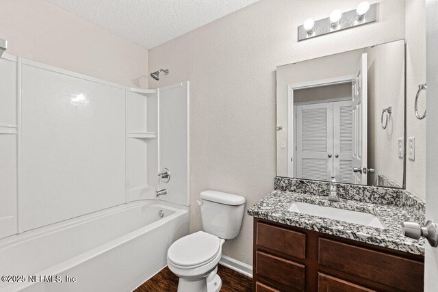 3143 Post St, Jacksonville, FL 32205 - bathroom with wood finished floors, toilet, shower / bathtub combination, vanity, and baseboards
