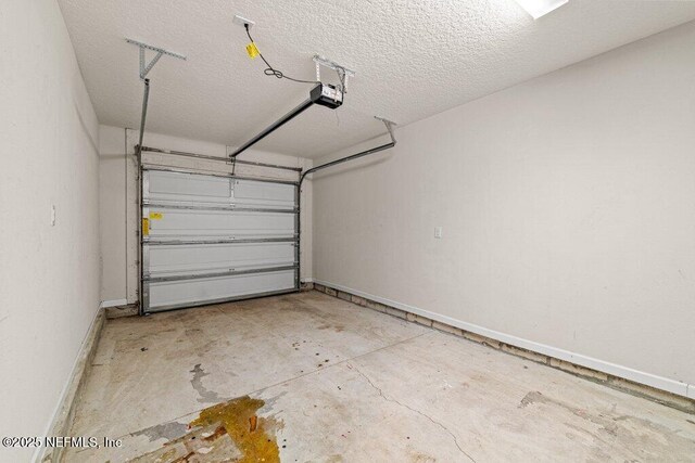 3143 Post St, Jacksonville, FL 32205 - garage featuring a garage door opener and baseboards
