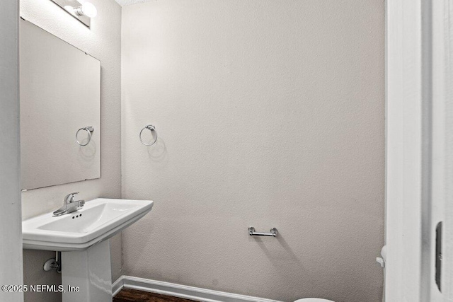3143 Post St, Jacksonville, FL 32205 - half bath with baseboards and wood finished floors
