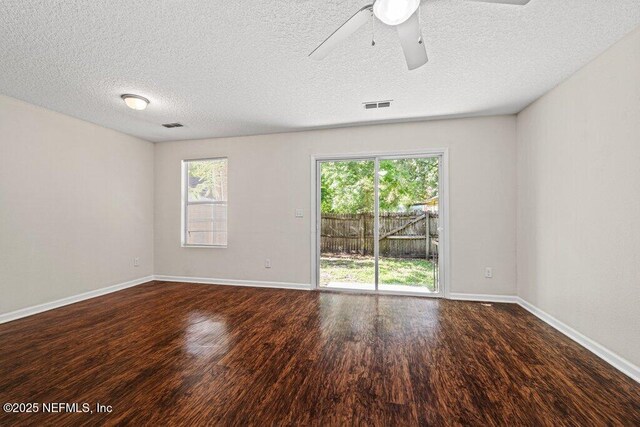 3143 Post St, Jacksonville, FL 32205 - spare room with wood finished floors, baseboards, a ceiling fan, and a textured ceiling