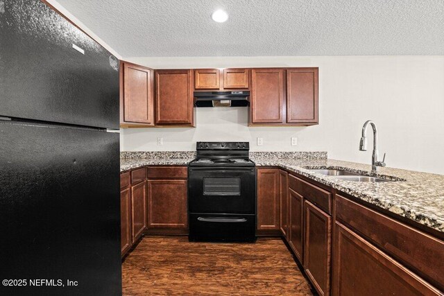 3143 Post St, Jacksonville, FL 32205 - kitchen featuring black appliances, a sink, under cabinet range hood, a textured ceiling, and dark wood-style flooring