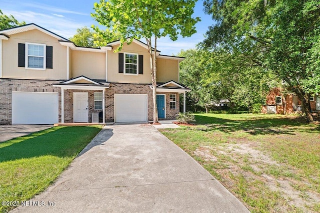 3143 Post St, Jacksonville, FL 32205 - view of front of property featuring brick siding, concrete driveway, a garage, and a front lawn
