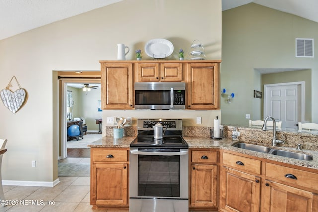 3684 Arava Dr, Green Cove Springs, FL 32043 - kitchen featuring stainless steel appliances, a sink, high vaulted ceiling, and light stone counters