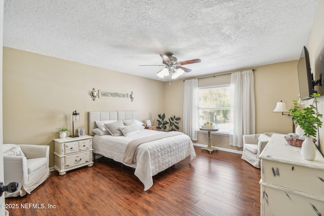 3684 Arava Dr, Green Cove Springs, FL 32043 - bedroom with dark wood finished floors, a textured ceiling, a ceiling fan, and baseboards