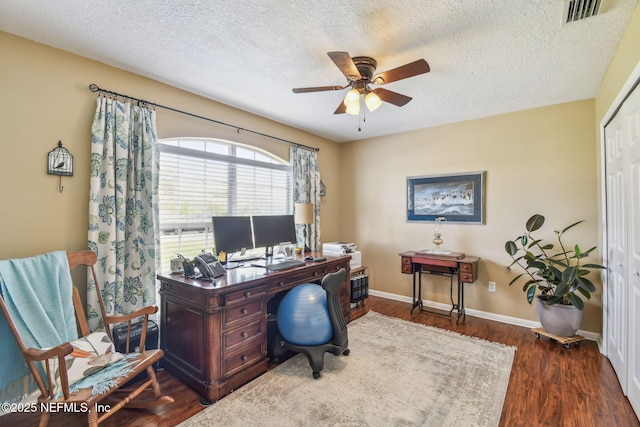 3684 Arava Dr, Green Cove Springs, FL 32043 - home office featuring a ceiling fan, a textured ceiling, wood finished floors, and baseboards