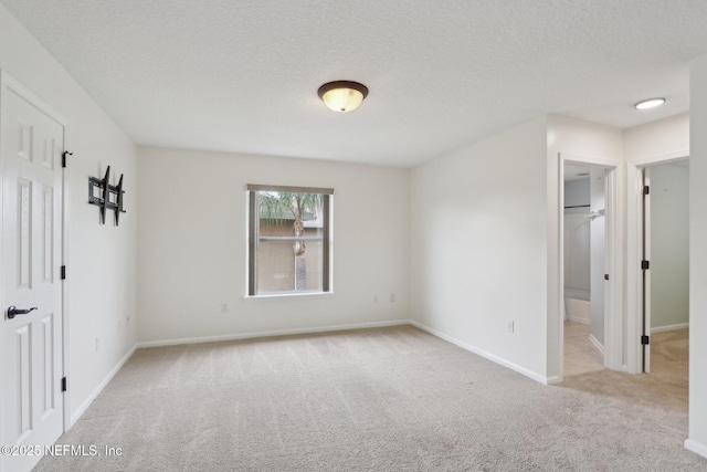 1726 Chatham Village Dr, Fleming Island, FL 32003 - unfurnished bedroom with carpet flooring, baseboards, and a textured ceiling