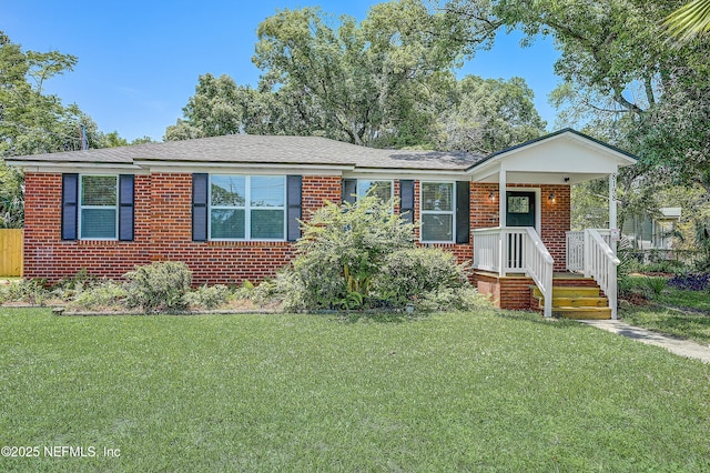 8198 Paul Jones Dr, Jacksonville, FL 32208 - ranch-style home with a front yard and brick siding