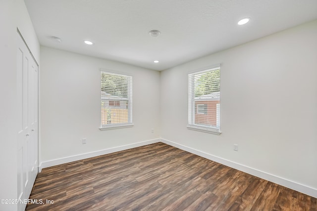 8198 Paul Jones Dr, Jacksonville, FL 32208 - unfurnished bedroom featuring dark wood-style floors, a closet, baseboards, and recessed lighting
