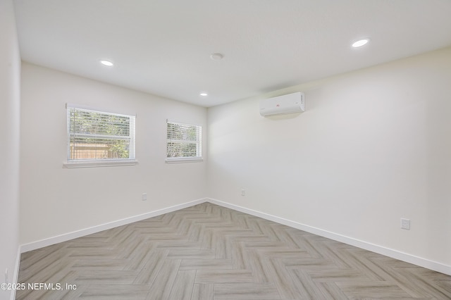 8198 Paul Jones Dr, Jacksonville, FL 32208 - spare room with a wall mounted AC, baseboards, and recessed lighting