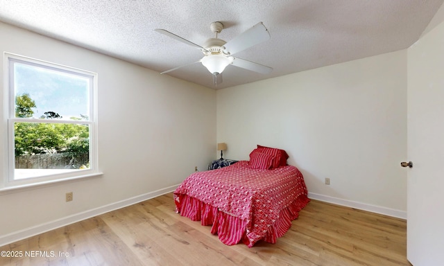 5325 Julington Ridge Dr S, Jacksonville, FL 32258 - bedroom with wood finished floors, baseboards, a textured ceiling, and ceiling fan