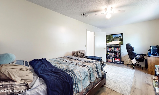 5325 Julington Ridge Dr S, Jacksonville, FL 32258 - bedroom featuring wood finished floors, a textured ceiling, and ceiling fan
