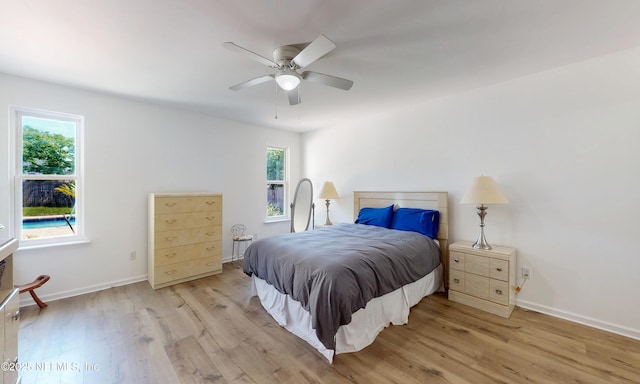 5325 Julington Ridge Dr S, Jacksonville, FL 32258 - bedroom featuring light wood-style floors, multiple windows, and baseboards