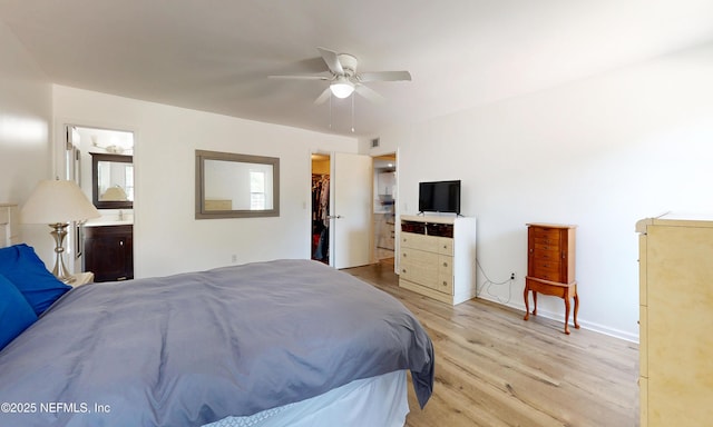 5325 Julington Ridge Dr S, Jacksonville, FL 32258 - bedroom with light wood-style floors, a walk in closet, a ceiling fan, and connected bathroom