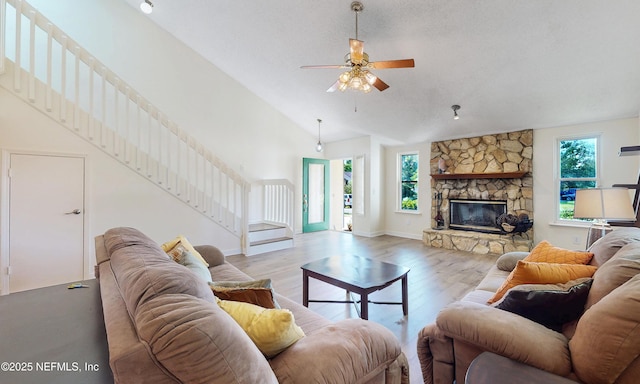 5325 Julington Ridge Dr S, Jacksonville, FL 32258 - living room featuring stairway, a ceiling fan, wood finished floors, high vaulted ceiling, and baseboards