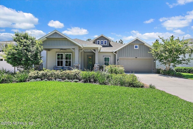 529 Crosswater Lake Dr, Ponte Vedra, FL 32081 - craftsman-style home with board and batten siding, a front yard, driveway, a garage, and a ceiling fan