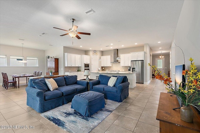 529 Crosswater Lake Dr, Ponte Vedra, FL 32081 - living area with light tile patterned floors, ceiling fan, a textured ceiling, baseboards, and recessed lighting