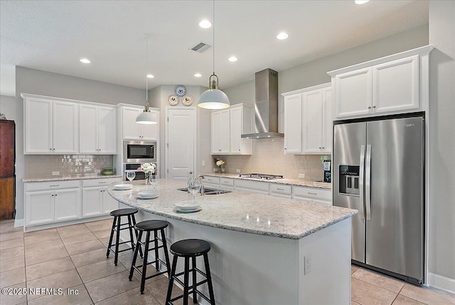 529 Crosswater Lake Dr, Ponte Vedra, FL 32081 - kitchen featuring stainless steel appliances, a sink, wall chimney exhaust hood, light tile patterned flooring, and backsplash