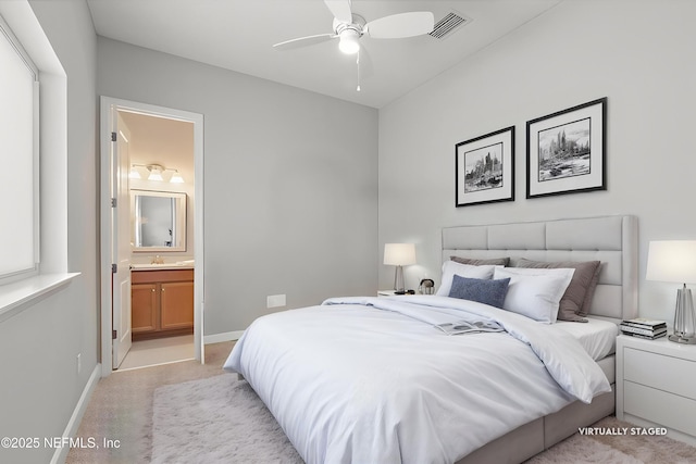 529 Crosswater Lake Dr, Ponte Vedra, FL 32081 - bedroom with light colored carpet, ensuite bath, baseboards, a sink, and ceiling fan