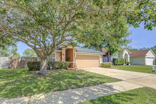 1695 Northglen Cir, Middleburg, FL 32068 - view of front of property featuring stucco siding, a garage, and concrete driveway
