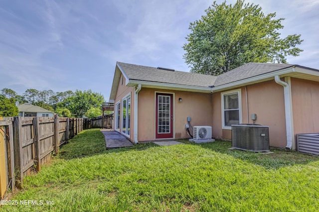 1695 Northglen Cir, Middleburg, FL 32068 - back of property with central AC unit, ac unit, and stucco siding