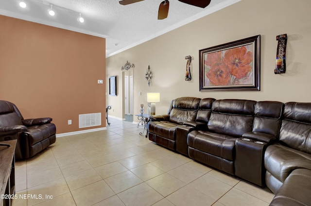 1695 Northglen Cir, Middleburg, FL 32068 - living area with crown molding, a ceiling fan, light tile patterned floors, a textured ceiling, and baseboards