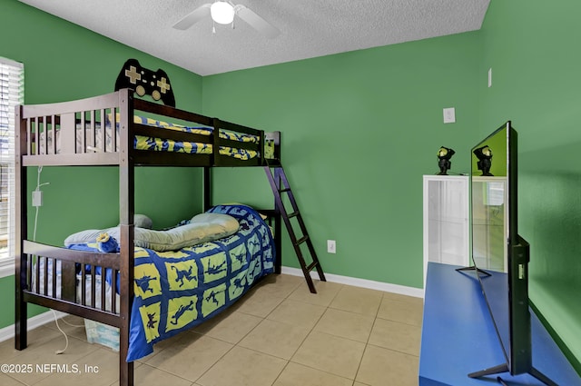 1695 Northglen Cir, Middleburg, FL 32068 - tiled bedroom featuring a textured ceiling, baseboards, and ceiling fan