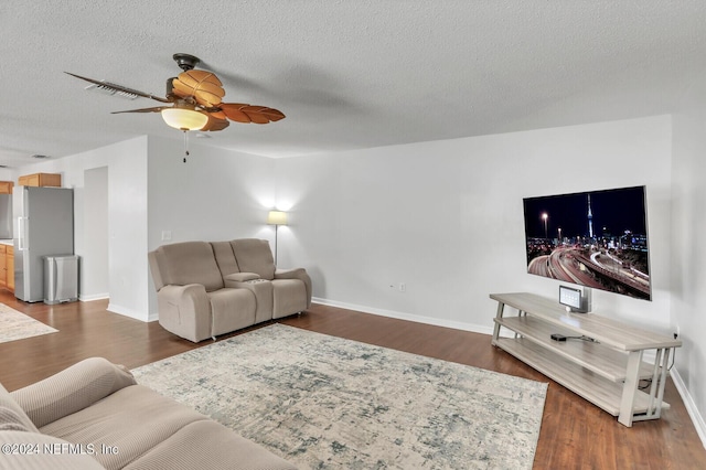 1483 Seawolf Trl N, Jacksonville, FL 32221 - living area with ceiling fan, baseboards, wood finished floors, and a textured ceiling