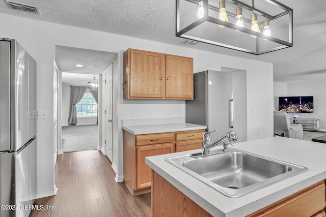 1483 Seawolf Trl N, Jacksonville, FL 32221 - kitchen featuring freestanding refrigerator, a sink, dark wood finished floors, baseboards, and light countertops