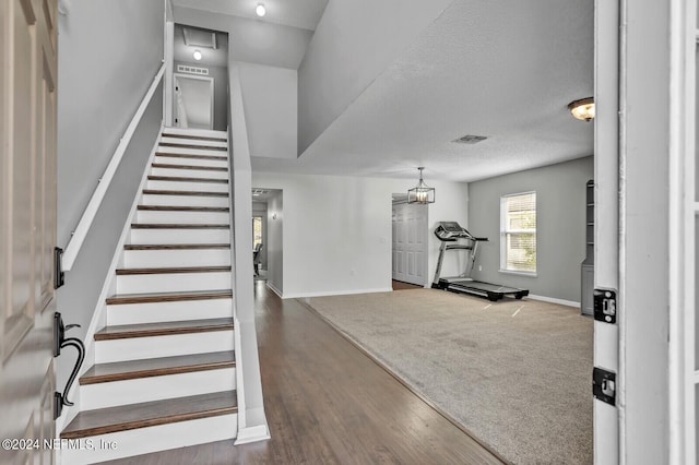 1483 Seawolf Trl N, Jacksonville, FL 32221 - foyer featuring baseboards, stairs, wood finished floors, and a textured ceiling