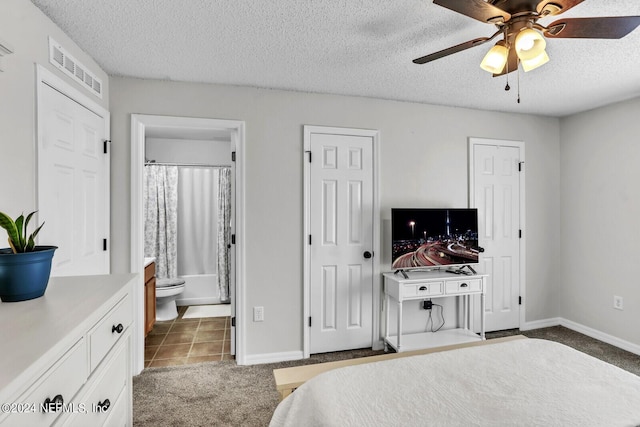 1483 Seawolf Trl N, Jacksonville, FL 32221 - bedroom with a textured ceiling, baseboards, two closets, ensuite bath, and carpet floors