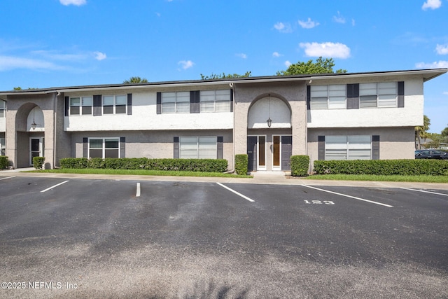 695 A1A N Unit 123, Ponte Vedra Beach, FL 32082 - view of property featuring uncovered parking