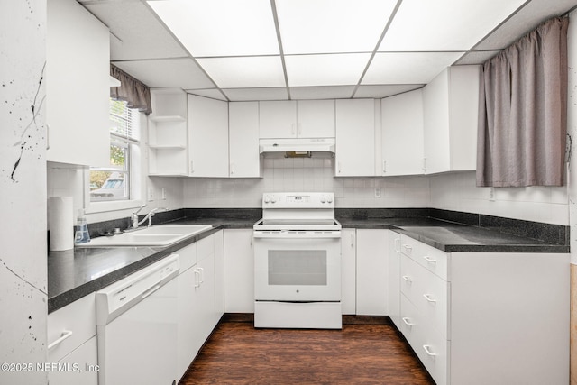 695 A1A N Unit 123, Ponte Vedra Beach, FL 32082 - kitchen with white appliances, under cabinet range hood, a drop ceiling, white cabinetry, and a sink