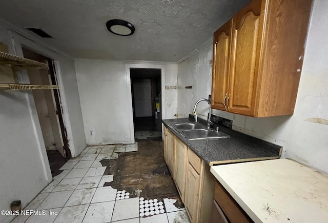1419 W 24th St, Jacksonville, FL 32209 - kitchen featuring a sink, brown cabinetry, a textured ceiling, and open shelves
