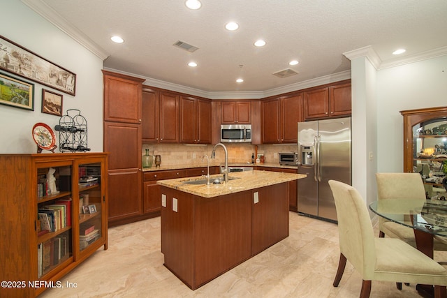 4300 S Beach Pkwy Unit 4306, Jacksonville Beach, FL 32250 - kitchen with appliances with stainless steel finishes, a sink, crown molding, light stone countertops, and a center island with sink