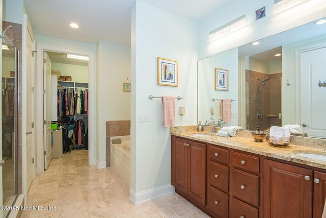 4300 S Beach Pkwy Unit 4306, Jacksonville Beach, FL 32250 - full bathroom with a shower stall, double vanity, a spacious closet, a garden tub, and recessed lighting