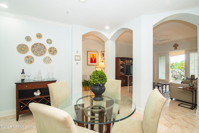 4300 S Beach Pkwy Unit 4306, Jacksonville Beach, FL 32250 - dining area with crown molding, arched walkways, recessed lighting, a ceiling fan, and baseboards
